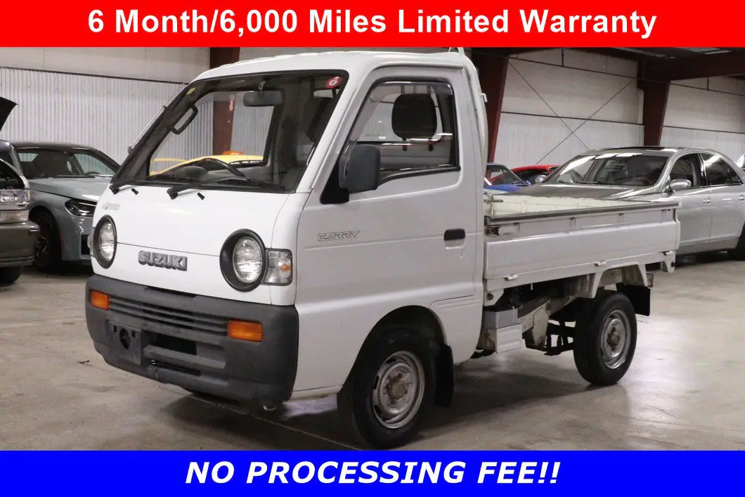 White 1991 Suzuki Carry Dump Bed 4x4 Kei Truck, front three-quarter view, for sale at Duncan Imports in Christiansburg, VA