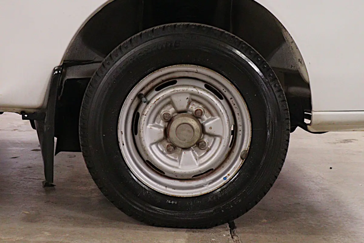 White 1991 Suzuki Carry Dump Bed 4x4 Kei Truck, wheel and tire, for sale at Duncan Imports in Christiansburg, VA