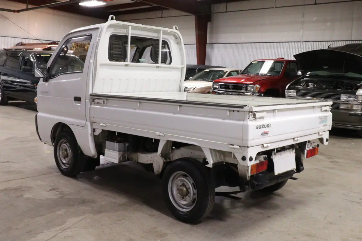 White 1991 Suzuki Carry Dump Bed 4x4 Kei Truck, rear three-quarter view, for sale at Duncan Imports in Christiansburg, VA