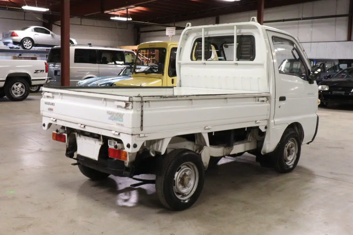 White 1991 Suzuki Carry Dump Bed 4x4 Kei Truck, rear three-quarter view, for sale at Duncan Imports in Christiansburg, VA