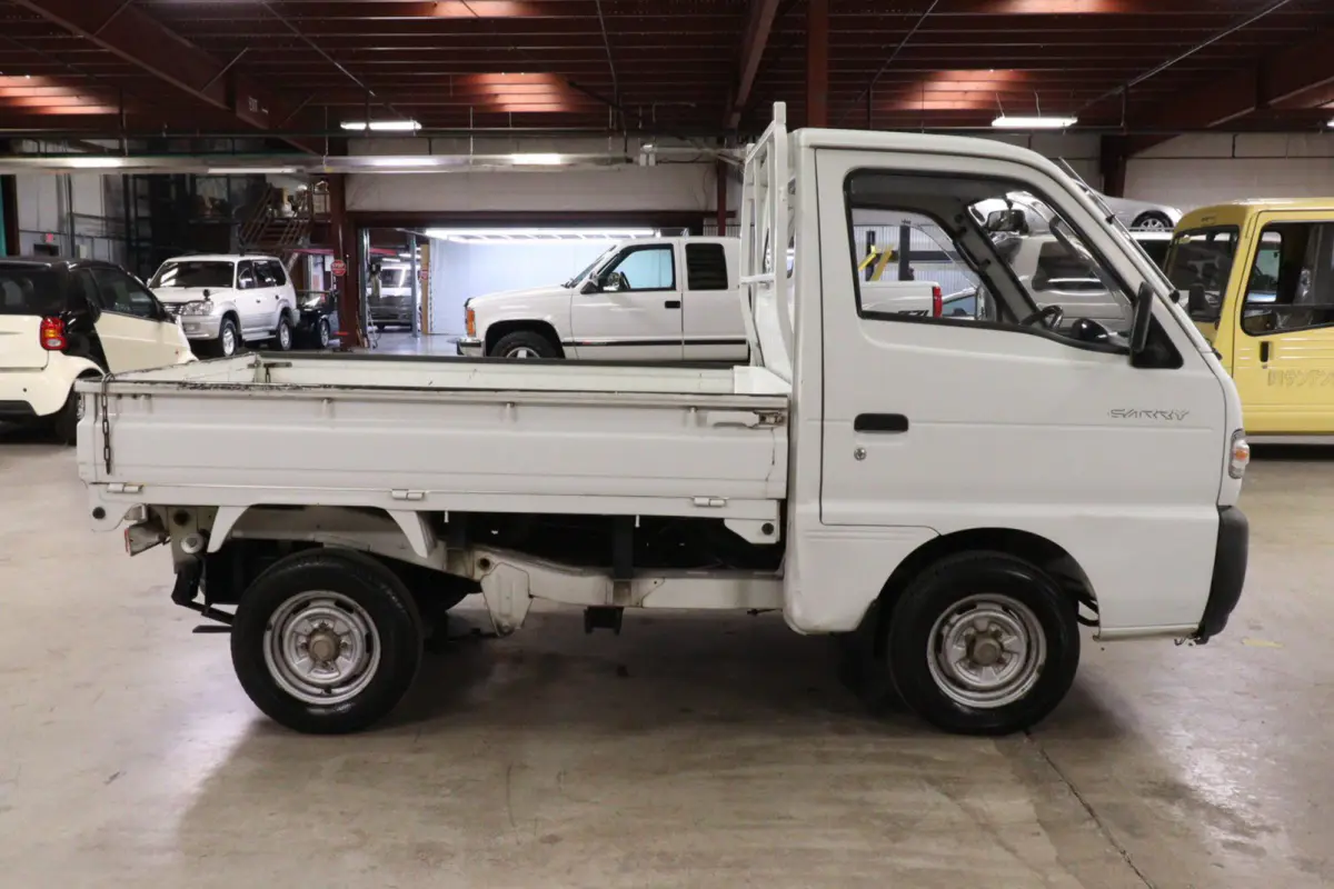 White 1991 Suzuki Carry Dump Bed 4x4 Kei Truck, side view, for sale at Duncan Imports in Christiansburg, VA