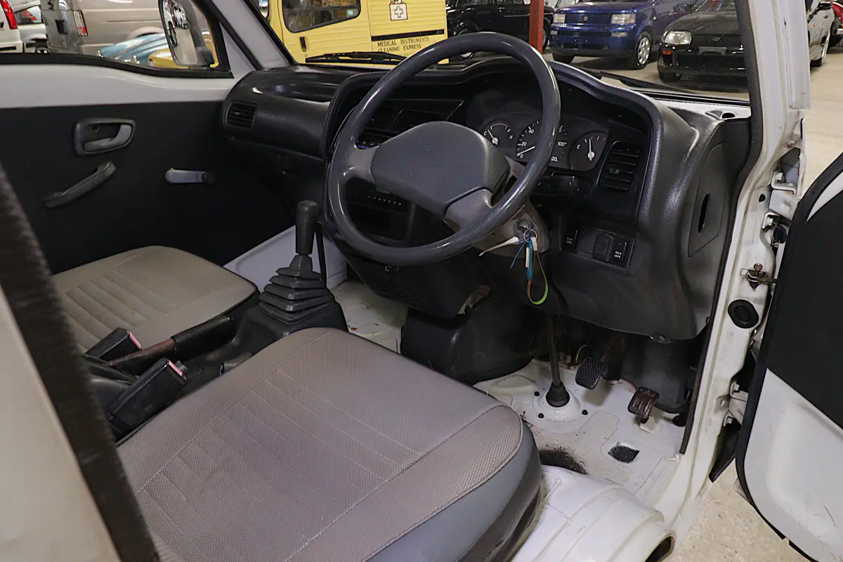White 1991 Suzuki Carry Dump Bed 4x4 Kei Truck, cab interior, for sale at Duncan Imports in Christiansburg, VA