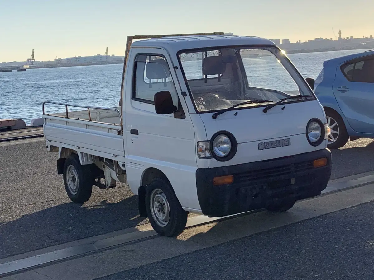 1993 Suzuki Carry, 2WD + Low Miles, a Kei Truck, for sale at Sunshine Imports in Austin, TX (photo 1 of 12)