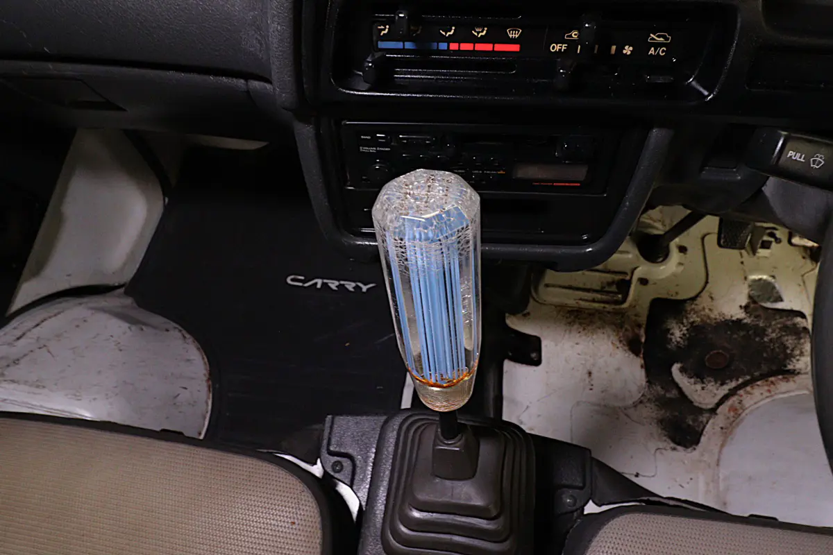 White 1993 Suzuki Carry 4x4 Kei Truck, gear shifter, for sale at Duncan Imports in Christiansburg, VA