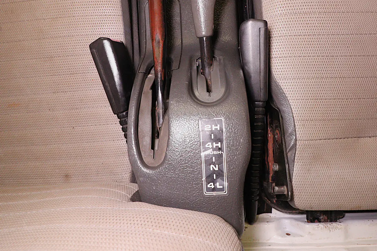 White 1993 Suzuki Carry 4x4 Kei Truck, 4WD lever and handbrake, for sale at Duncan Imports in Christiansburg, VA