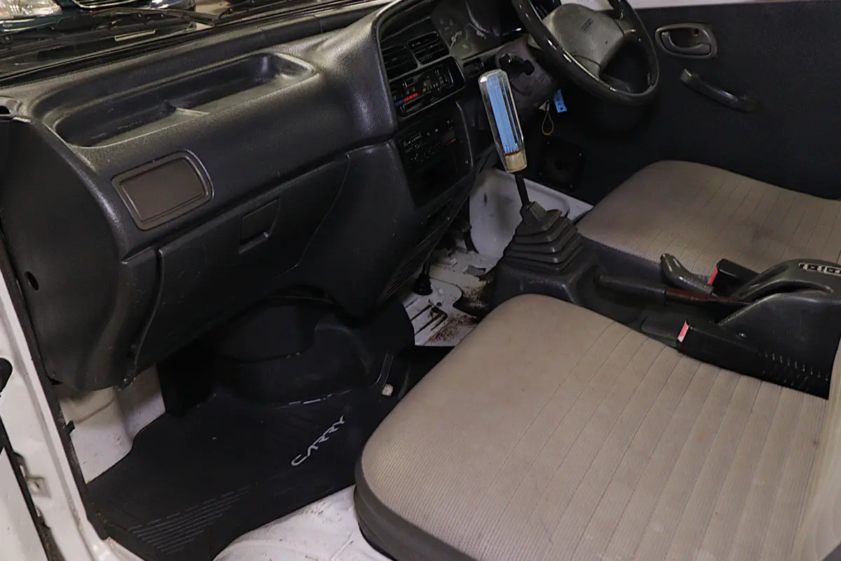 White 1993 Suzuki Carry 4x4 Kei Truck, cab interior, for sale at Duncan Imports in Christiansburg, VA