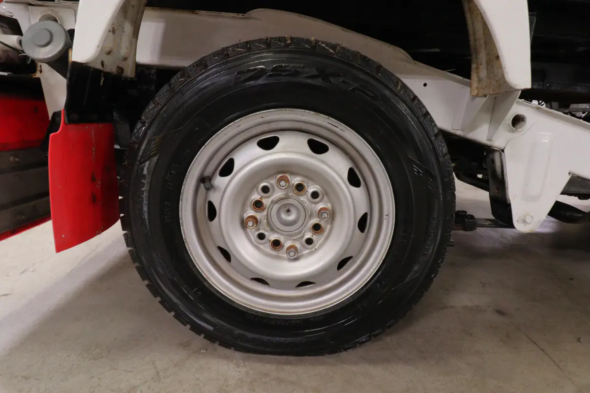 White 1993 Suzuki Carry 4x4 Kei Truck, wheel and tire, for sale at Duncan Imports in Christiansburg, VA