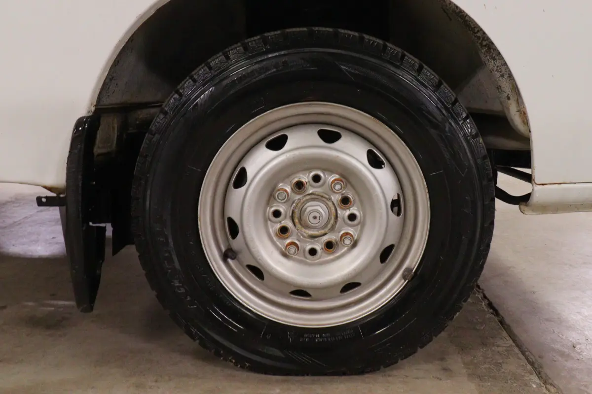 White 1993 Suzuki Carry 4x4 Kei Truck, wheel and tire, for sale at Duncan Imports in Christiansburg, VA