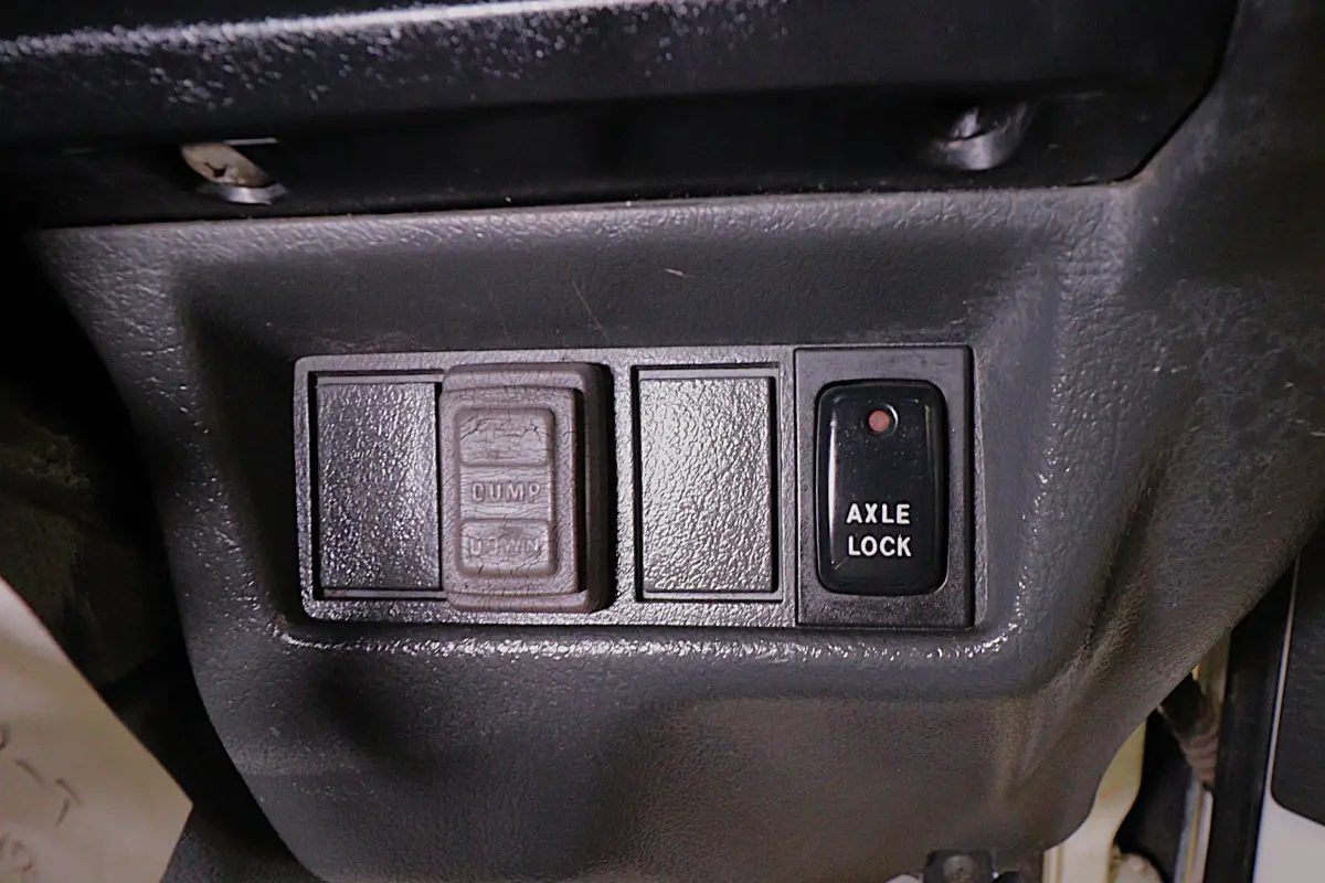 White 1993 Suzuki Carry 4x4 Kei Truck, dump and axle lock switches, for sale at Duncan Imports in Christiansburg, VA