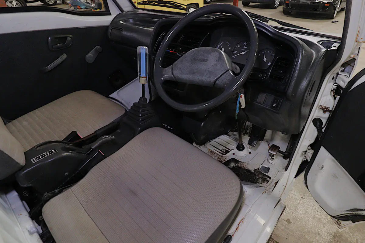 White 1993 Suzuki Carry 4x4 Kei Truck, cab interior, for sale at Duncan Imports in Christiansburg, VA
