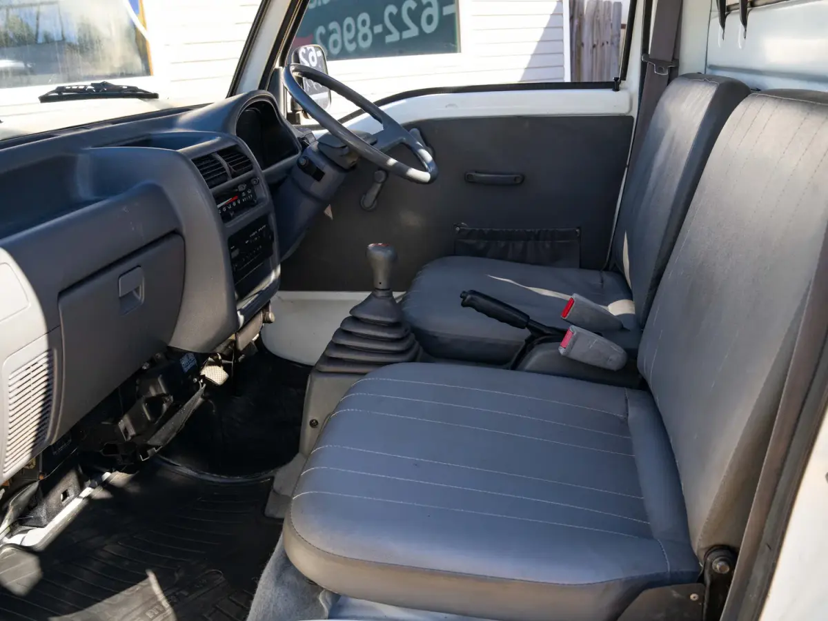 White 1994 Subaru Sambar Dump Bed 4x4 Kei Truck, cab interior and seats, for sale at Japan Direct Motors in Irmo, SC