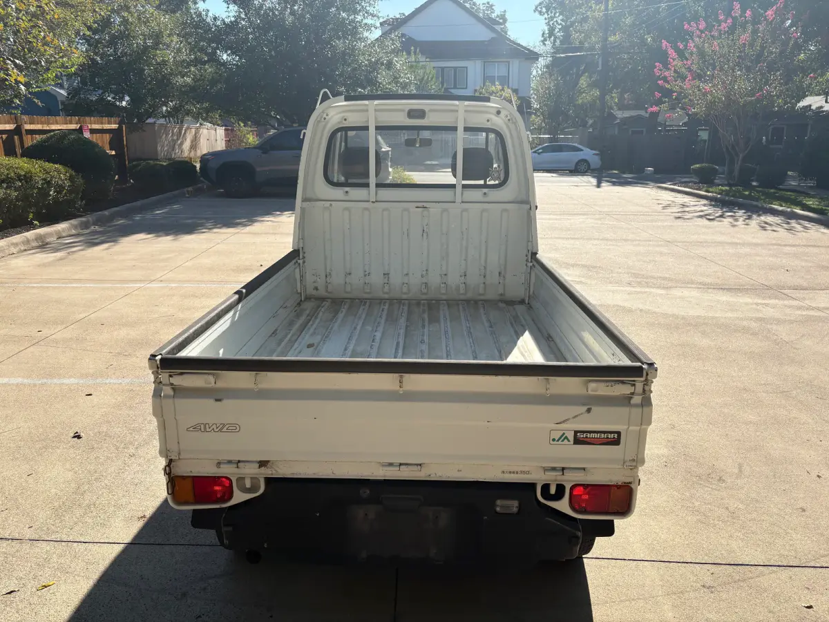 1995 Subaru Sambar 4x4 Kei Truck, rear view with cargo bed, for sale at Sunshine Imports in Austin, TX