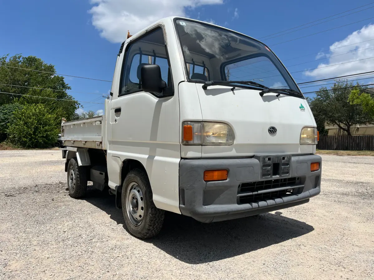 1995 Subaru Sambar Dump Truck, 4WD + AC, a Kei Truck, for sale at Sunshine Imports in Austin, TX (photo 1 of 12)