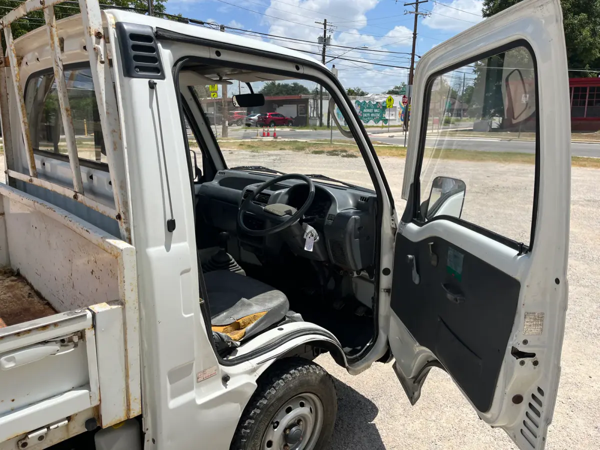 1995 Subaru Sambar Dump Truck, 4WD + AC, a Kei Truck, for sale at Sunshine Imports in Austin, TX (photo 6 of 12)