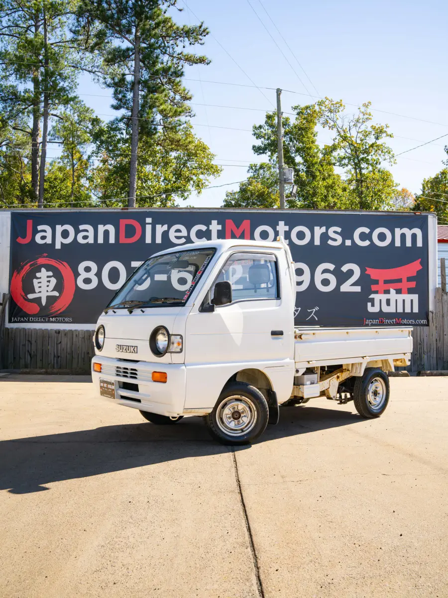 White 1995 Suzuki Carry 4x4 Kei Truck, front three-quarter view, for sale at Japan Direct Motors in Irmo, SC