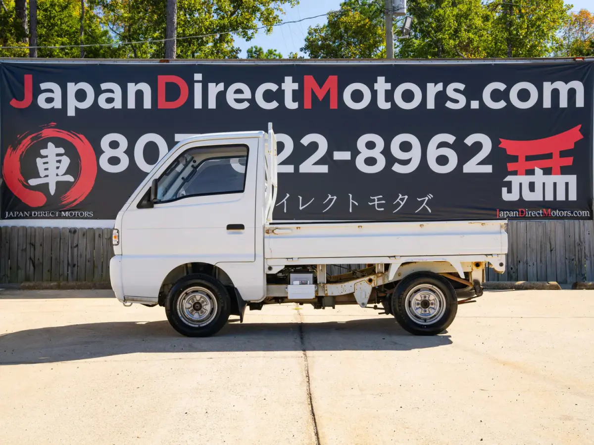 White 1995 Suzuki Carry 4x4 Kei Truck, side view, for sale at Japan Direct Motors in Irmo, SC