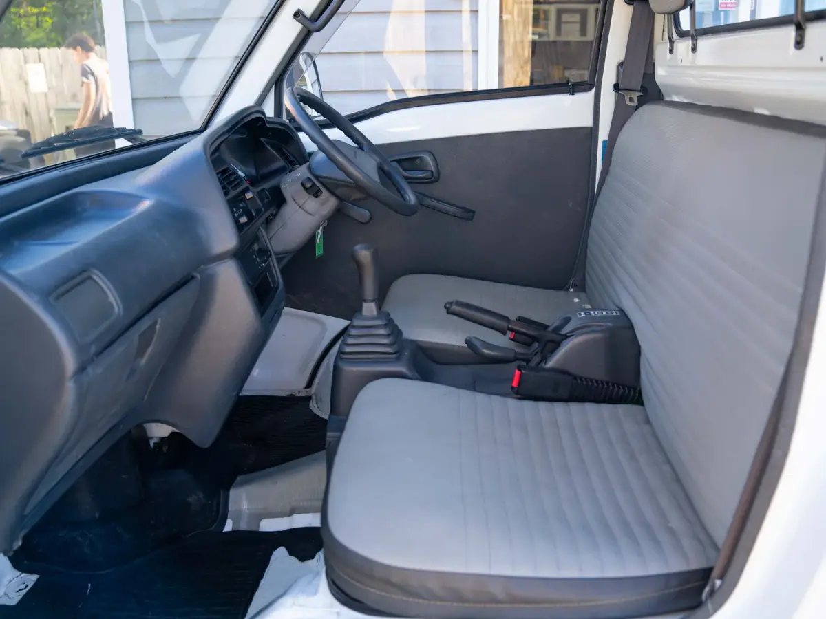 White 1995 Suzuki Carry 4x4 Kei Truck, cab interior, for sale at Japan Direct Motors in Irmo, SC