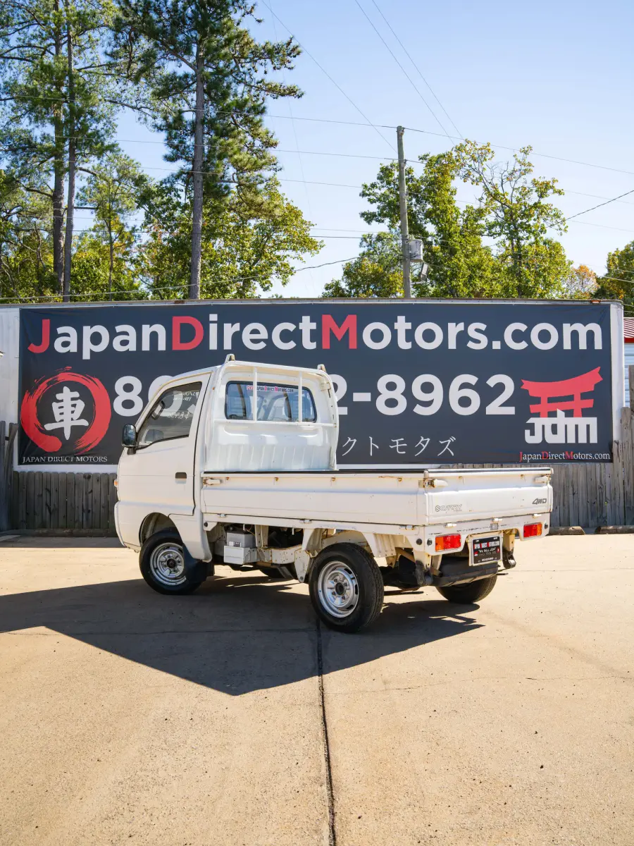 White 1995 Suzuki Carry 4x4 Kei Truck, rear three-quarter view, for sale at Japan Direct Motors in Irmo, SC
