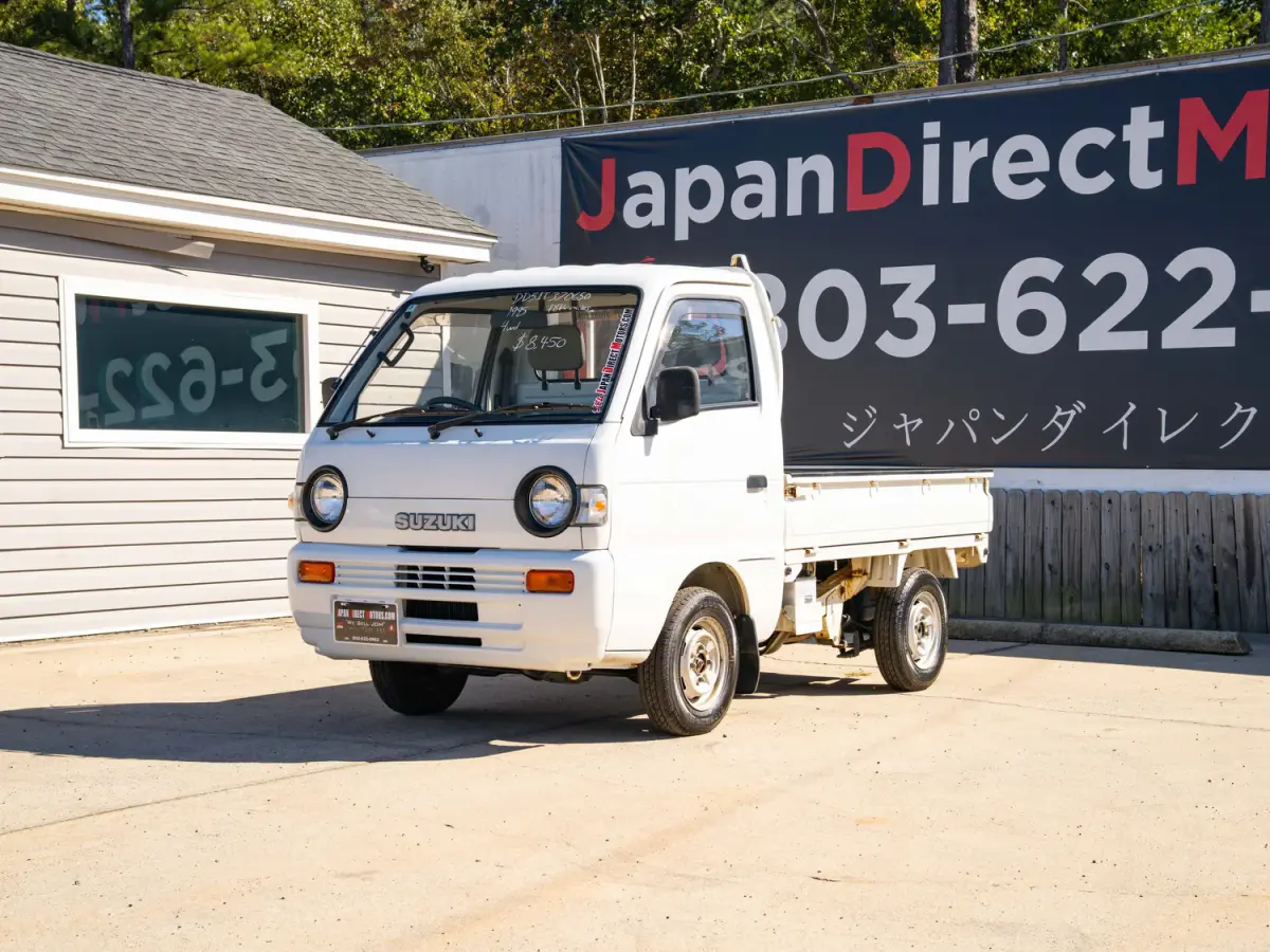White 1995 Suzuki Carry 4x4 Kei Truck, front three-quarter view, for sale at Japan Direct Motors in Irmo, SC