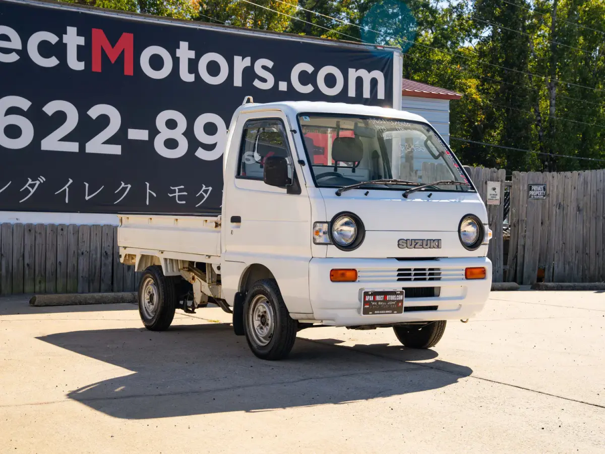 White 1995 Suzuki Carry 4x4 Kei Truck, front three-quarter view, for sale at Japan Direct Motors in Irmo, SC