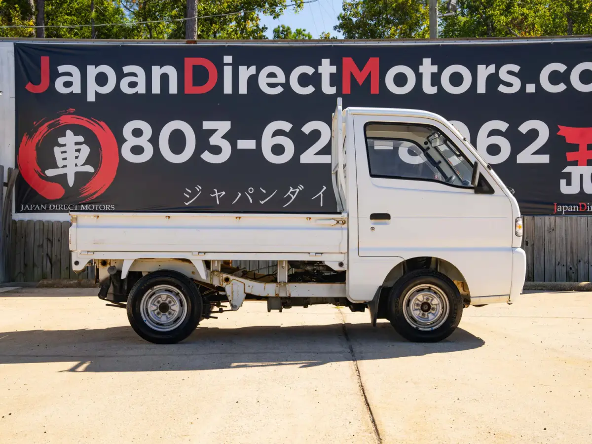 White 1995 Suzuki Carry 4x4 Kei Truck, side view, for sale at Japan Direct Motors in Irmo, SC