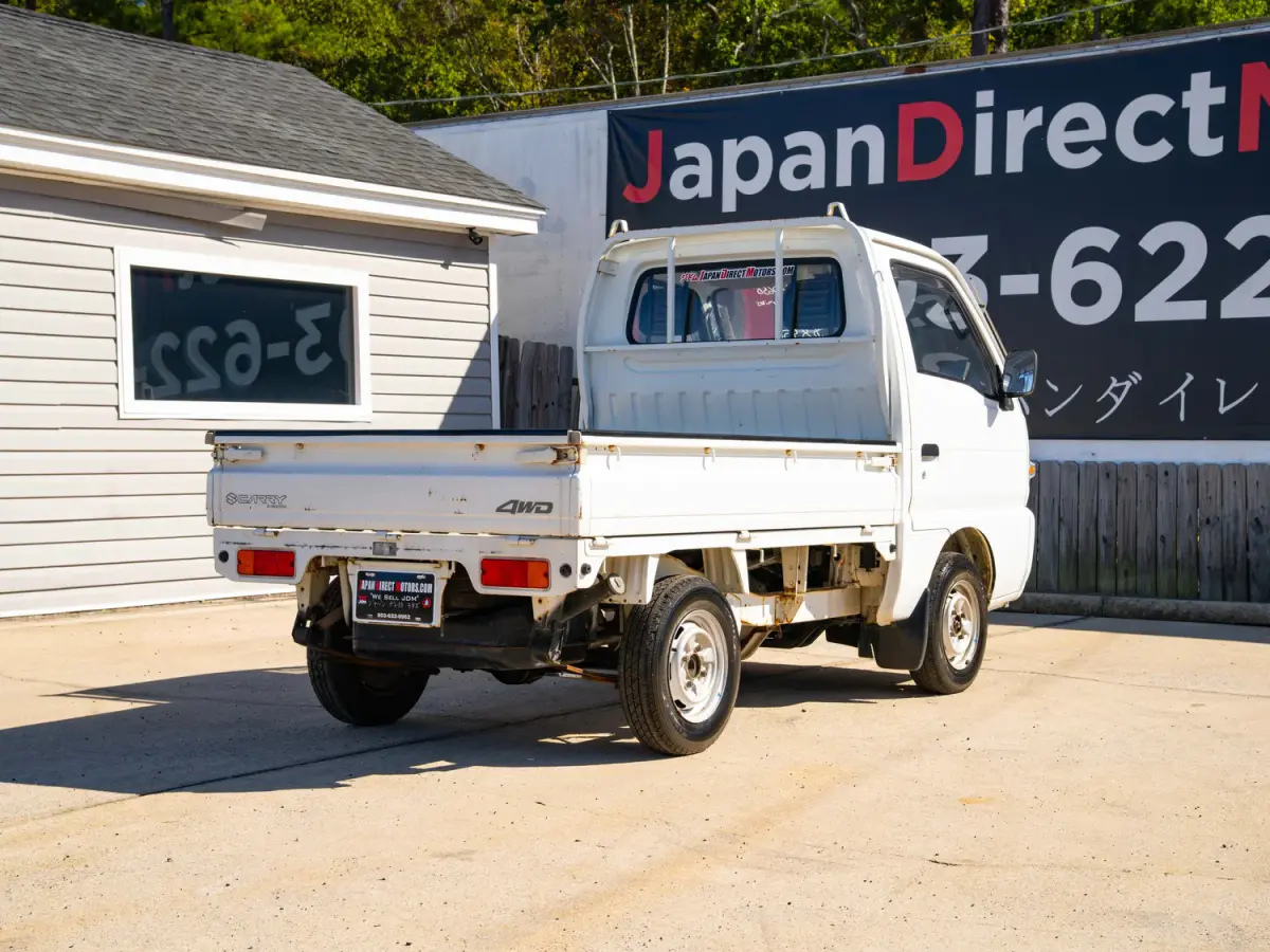 White 1995 Suzuki Carry 4x4 Kei Truck, rear three-quarter view, for sale at Japan Direct Motors in Irmo, SC