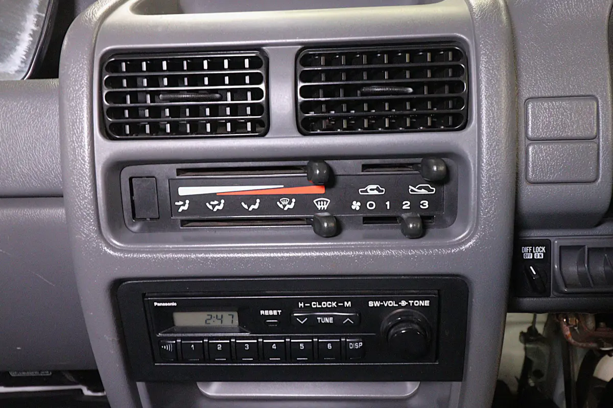 1996 Subaru Sambar 4x4 Kei Truck, heater controls and radio, for sale at Duncan Imports in Christiansburg, VA