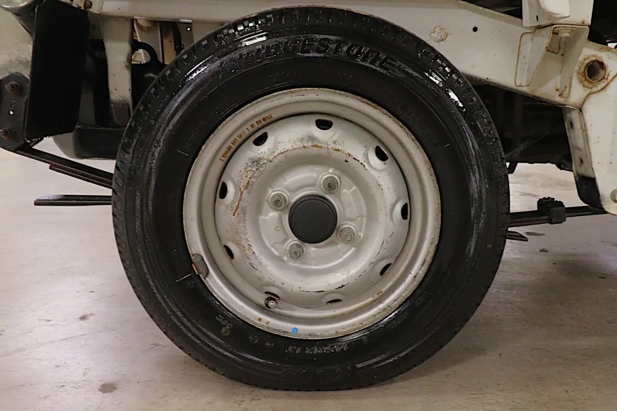 White 1996 Suzuki Carry Dump Bed 4x4 Kei Truck, wheel and tire, for sale at Duncan Imports in Christiansburg, VA