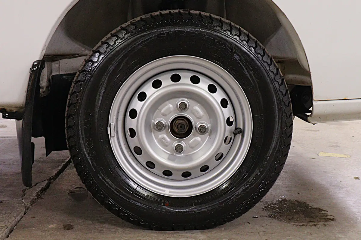 White 1996 Suzuki Carry Dump Bed 4x4 Kei Truck, wheel and tire, for sale at Duncan Imports in Christiansburg, VA