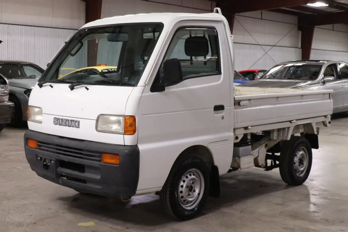 White 1996 Suzuki Carry Dump Bed 4x4 Kei Truck, front three-quarter view, for sale at Duncan Imports in Christiansburg, VA