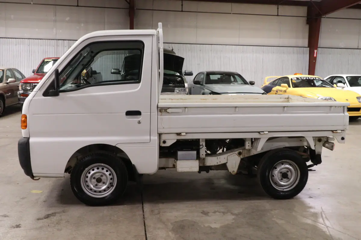 White 1996 Suzuki Carry Dump Bed 4x4 Kei Truck, side view, for sale at Duncan Imports in Christiansburg, VA