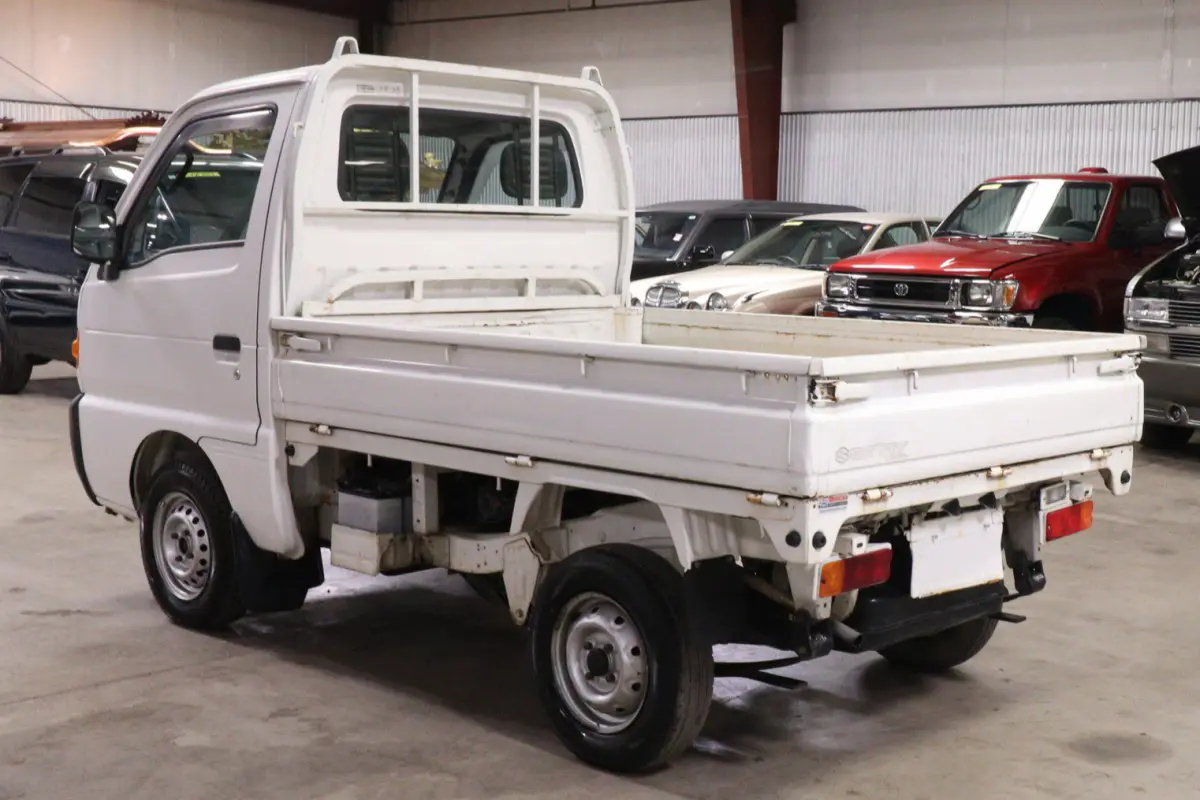 White 1996 Suzuki Carry Dump Bed 4x4 Kei Truck, rear three-quarter view, for sale at Duncan Imports in Christiansburg, VA