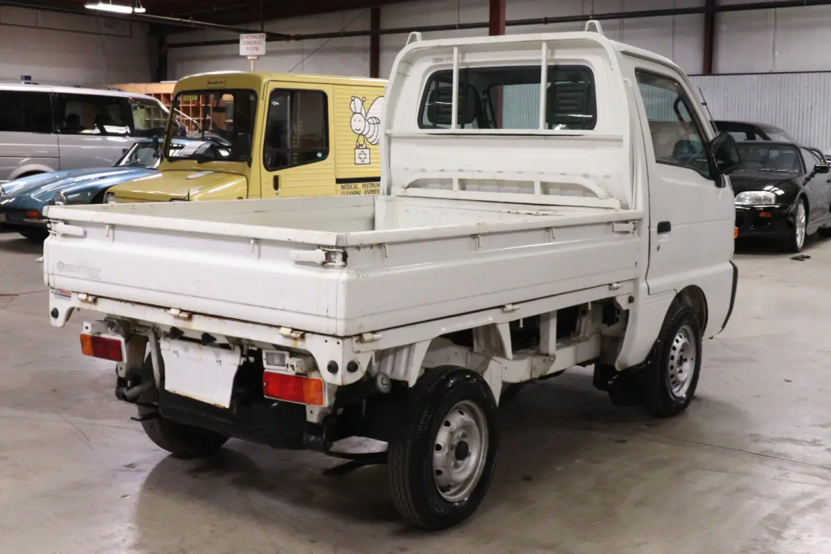 White 1996 Suzuki Carry Dump Bed 4x4 Kei Truck, rear three-quarter view, for sale at Duncan Imports in Christiansburg, VA