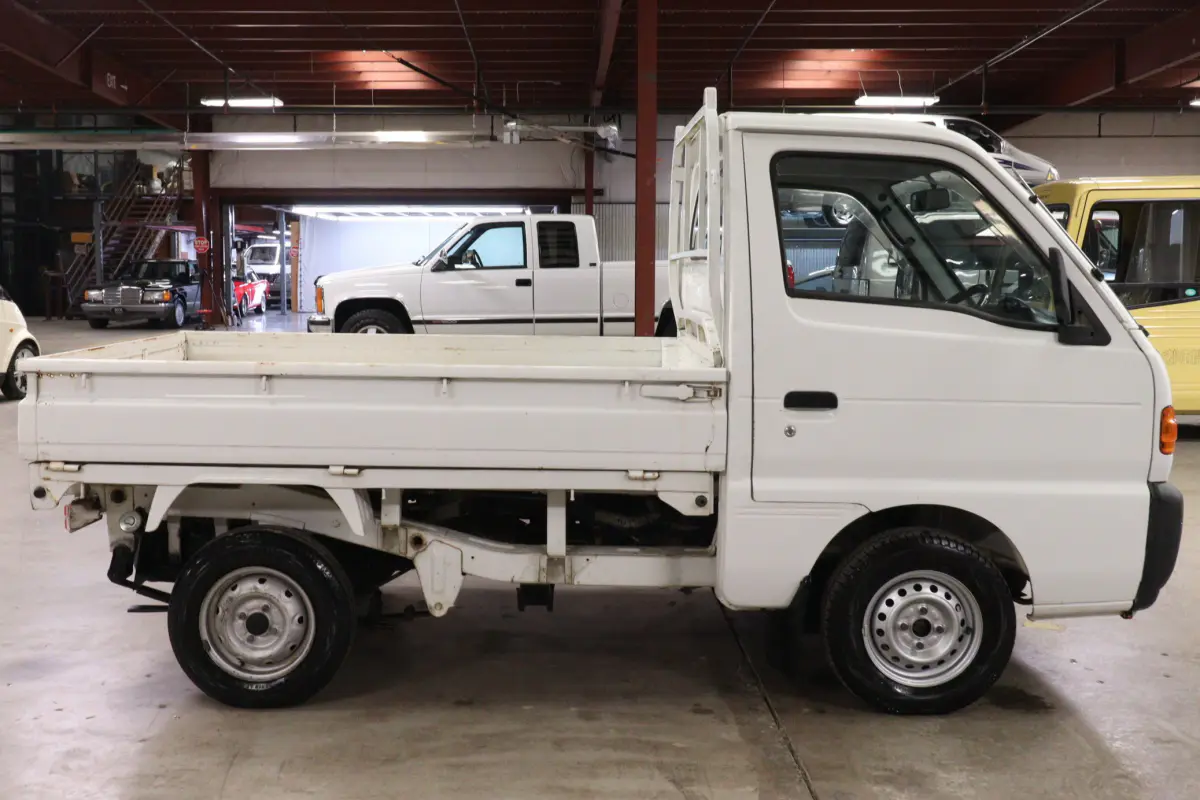 White 1996 Suzuki Carry Dump Bed 4x4 Kei Truck, side view, for sale at Duncan Imports in Christiansburg, VA