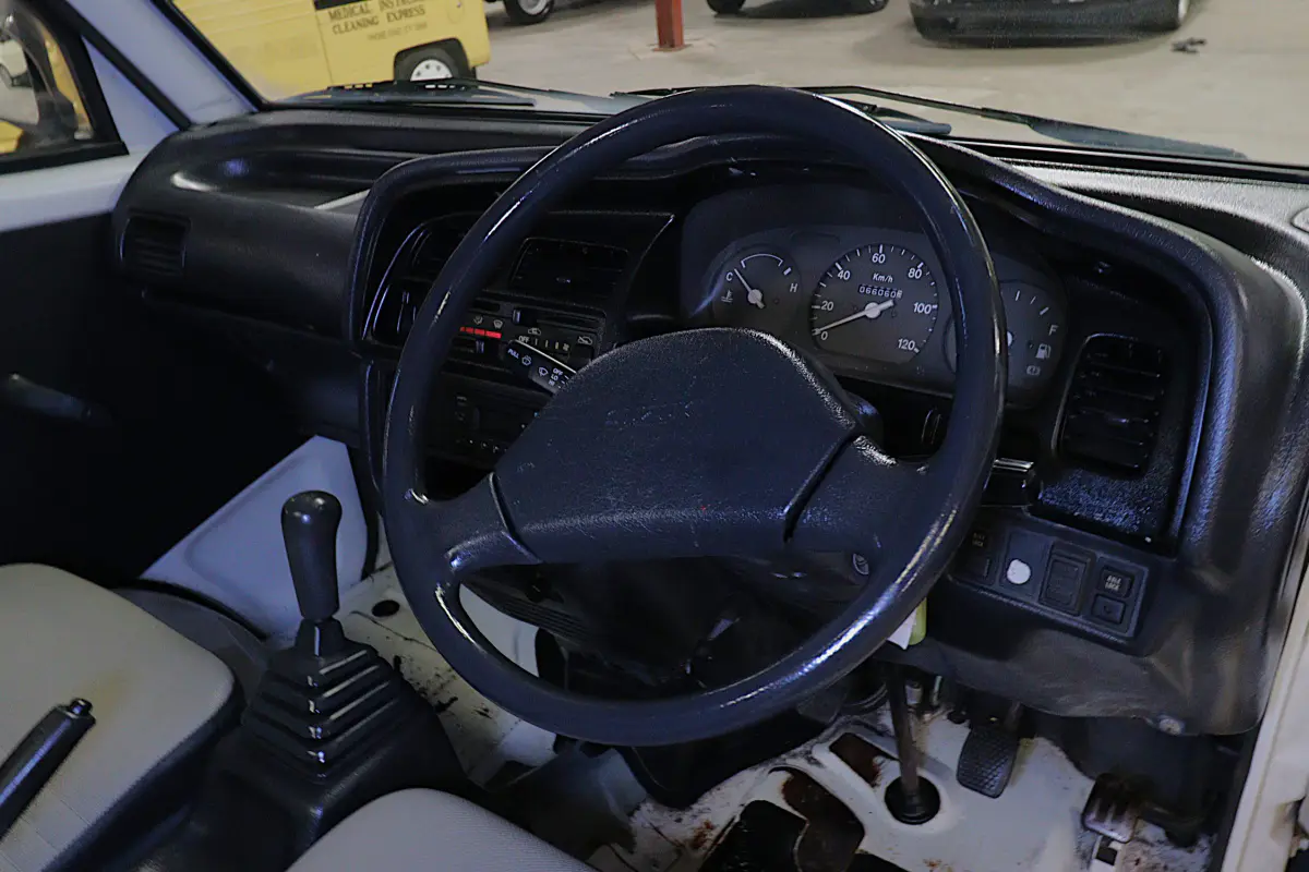 White 1996 Suzuki Carry Dump Bed 4x4 Kei Truck, cab interior, for sale at Duncan Imports in Christiansburg, VA