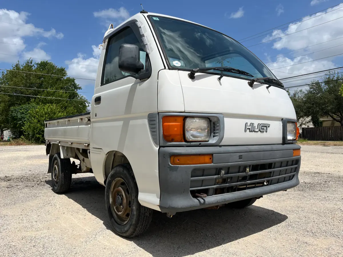 1997 Daihatsu Hijet 4x4 Kei Truck, front three-quarter view, for sale at Sunshine Imports in Austin, TX