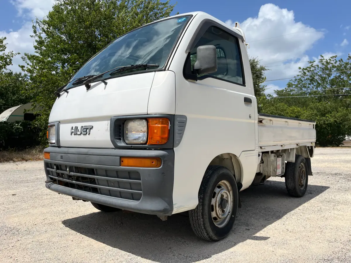 1997 Daihatsu Hijet 4x4 Kei Truck, front three-quarter view, for sale at Sunshine Imports in Austin, TX