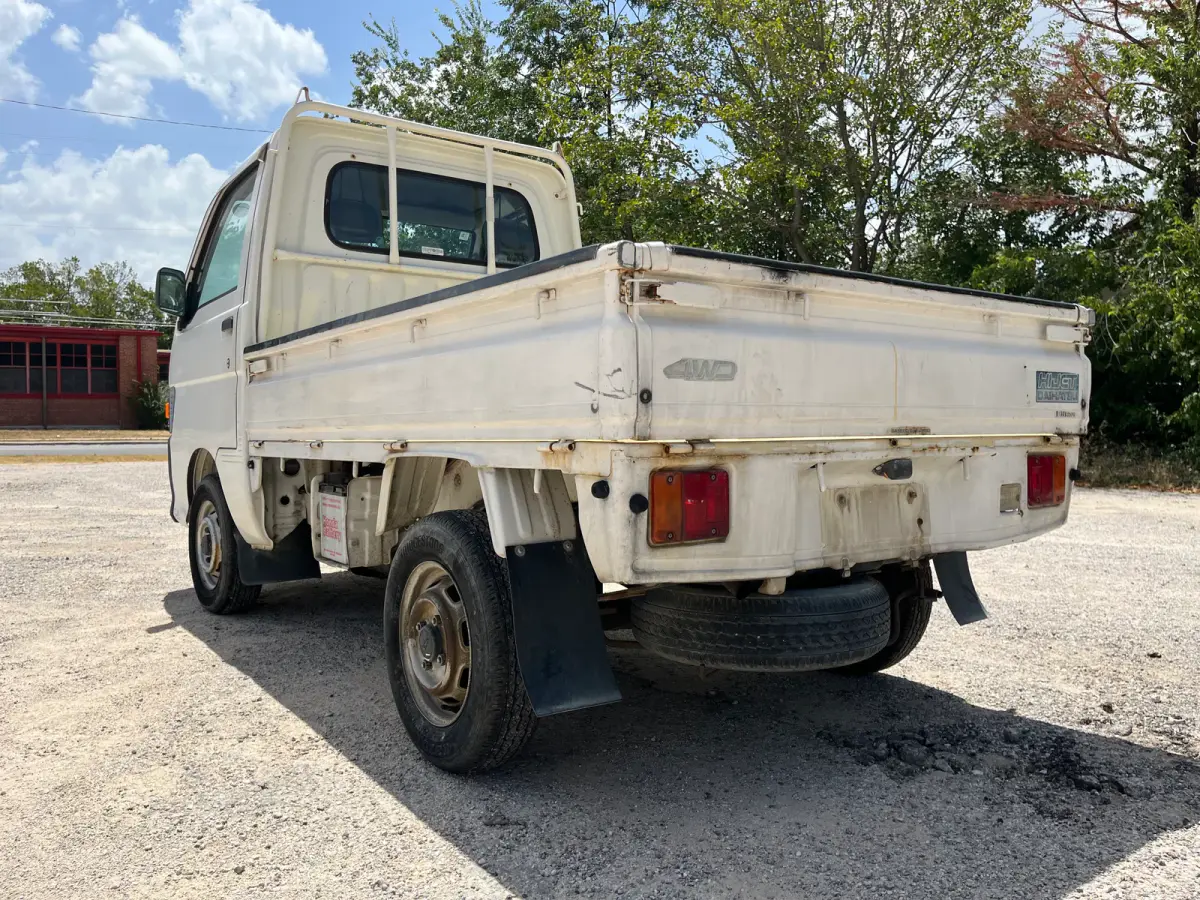 1997 Daihatsu Hijet 4x4 Kei Truck, rear three-quarter view, for sale at Sunshine Imports in Austin, TX