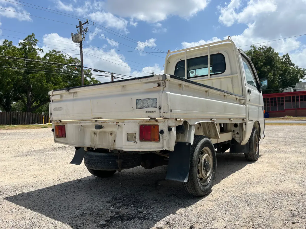 1997 Daihatsu Hijet 4x4 Kei Truck, rear three-quarter view, for sale at Sunshine Imports in Austin, TX