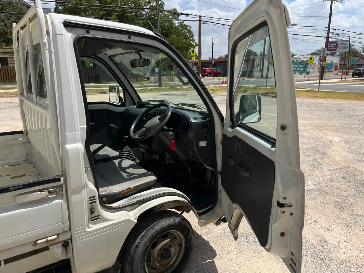 1997 Daihatsu Hijet 4x4 Kei Truck, open door and cab interior, for sale at Sunshine Imports in Austin, TX