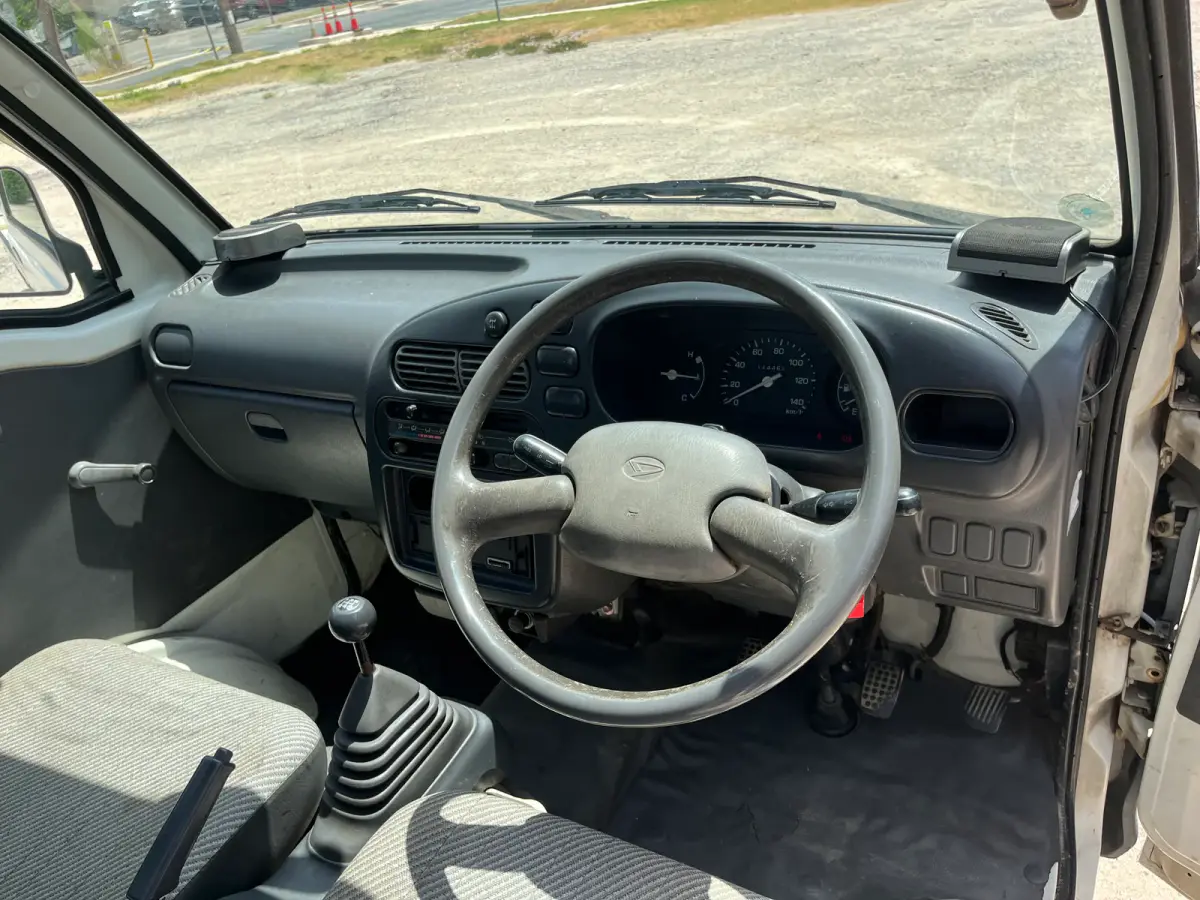 1997 Daihatsu Hijet 4x4 Kei Truck, steering wheel and dashboard, for sale at Sunshine Imports in Austin, TX