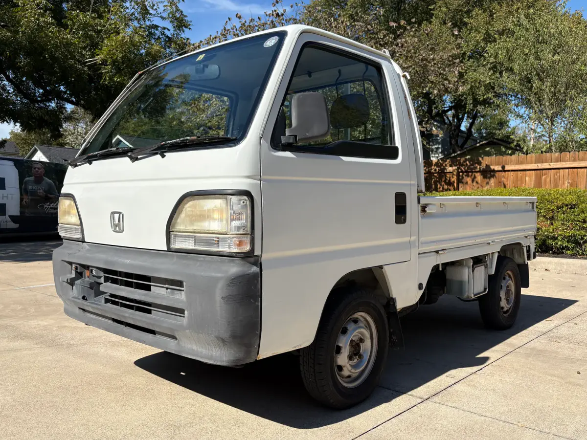 1997 Honda Acty 4x4 Kei Truck, front three-quarter view, for sale at Sunshine Imports in Austin, TX
