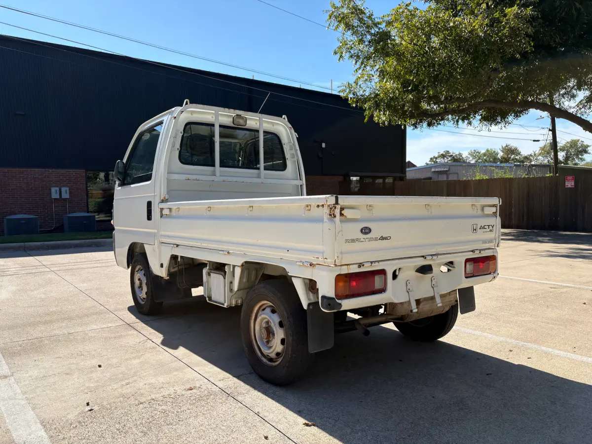 1997 Honda Acty 4x4 Kei Truck, rear three-quarter view, for sale at Sunshine Imports in Austin, TX