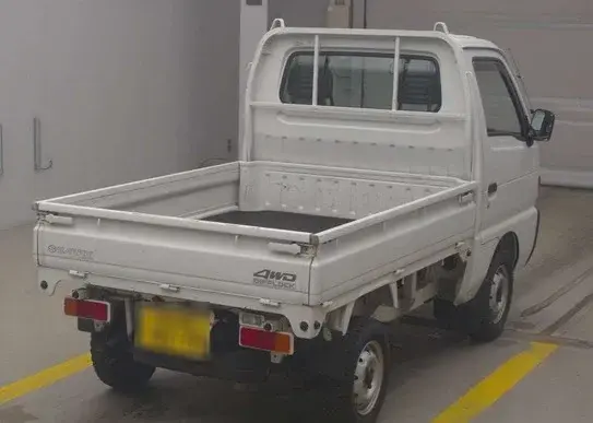 1997 Suzuki Carry 4WD Dump Truck, a white off-road Kei Truck, for sale at Weatherford Mini Trucks in Weatherford, TX (photo 3 of 6)