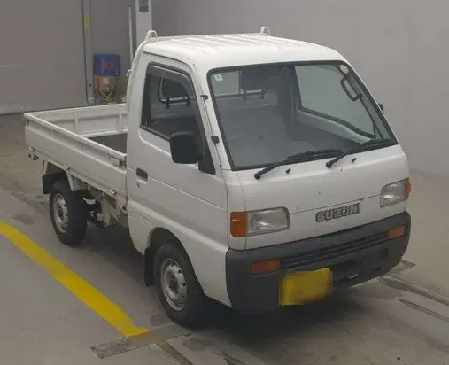1997 Suzuki Carry 4WD Dump Truck, a white off-road Kei Truck, for sale at Weatherford Mini Trucks in Weatherford, TX (photo 4 of 6)