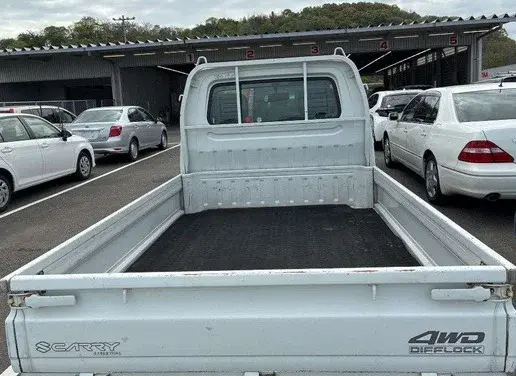 1997 Suzuki Carry 4WD Dump Truck, a white off-road Kei Truck, for sale at Weatherford Mini Trucks in Weatherford, TX (photo 5 of 6)