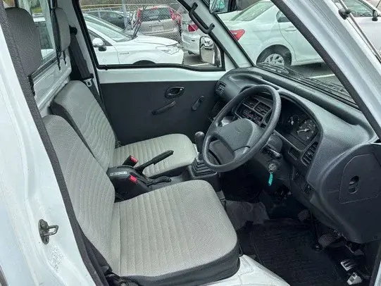 1997 Suzuki Carry 4WD Dump Truck, a white off-road Kei Truck, for sale at Weatherford Mini Trucks in Weatherford, TX (photo 6 of 6)