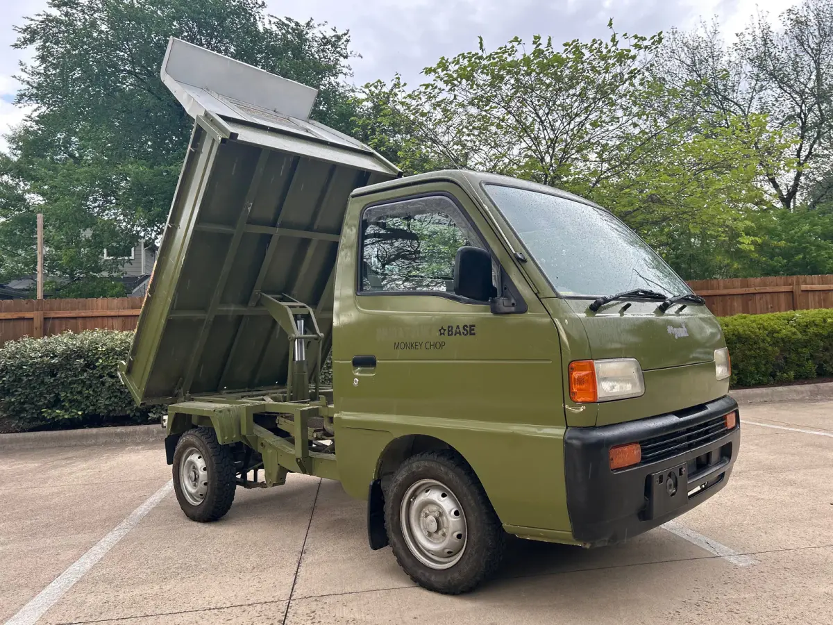 1997 Suzuki Carry Dump, 2WD + AC, a Kei Truck, for sale at Sunshine Imports in Austin, TX (photo 1 of 12)