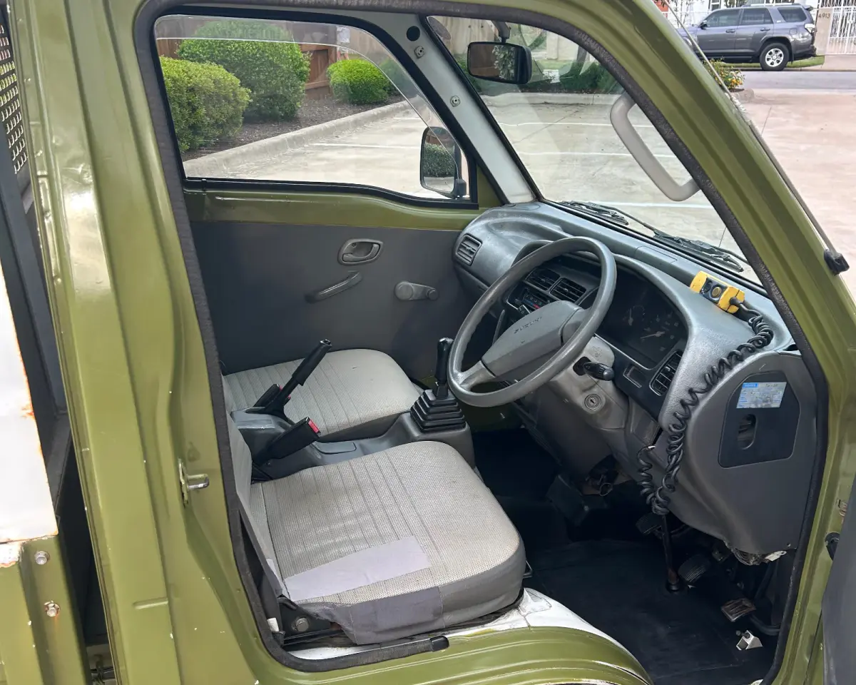 1997 Suzuki Carry Dump, 2WD + AC, a Kei Truck, for sale at Sunshine Imports in Austin, TX (photo 10 of 12)