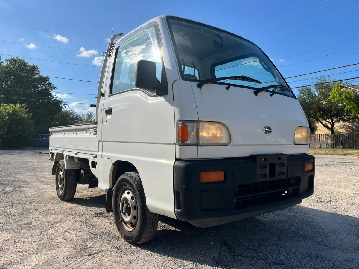 1998 Subaru Sambar 4x4 Kei Truck, front three-quarter view, sold at Sunshine Imports in Austin, TX